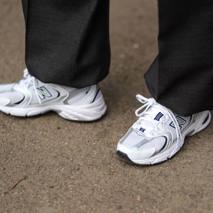 A guest wears New Balance sneakers shoes , outside Dolce & Gabbana, during the Milan Fashion Week Menswear Fall/Winter 2025-2026 on January 18, 2025 in Milan, Italy. (Photo by Edward Berthelot/Getty Images)