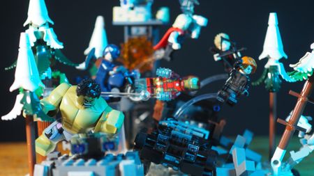 Lego Avengers in mid-air poses amongst snowy trees