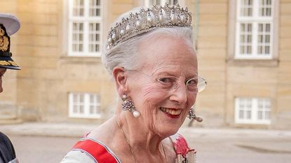 Queen Margrethe of Denmark’s flamingo-pink patterned gown seen as she arrives ahead of the dinner at Amalienborg Castle