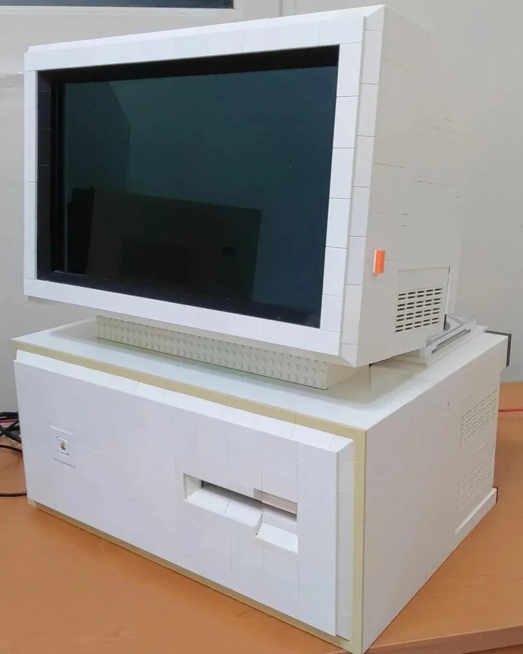 Custom desktop terminal featuring an OLED monitor with the PC case below, built from Lego-style bricks