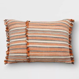 Striped orange, black and white cushion