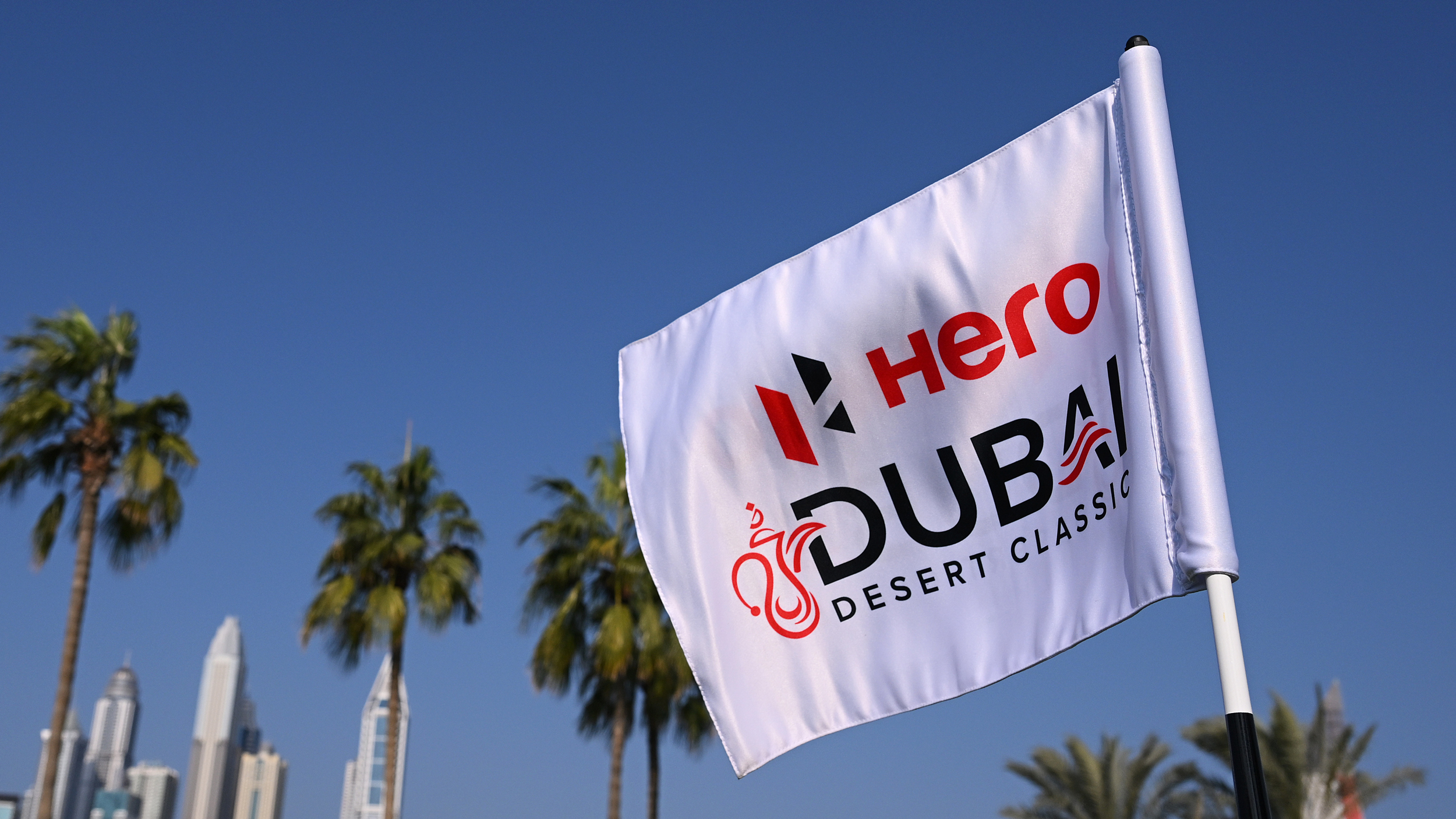 A white Hero Dubai Desert Classic flag