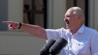 Belarus' President Alexander Lukashenko gestures as he delivers a speech during a rally held to support him in central Minsk, on August 16, 2020. 