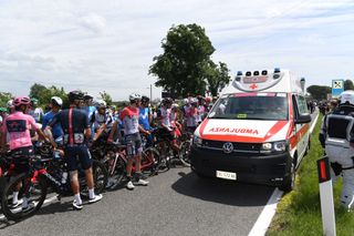 GORIZIA ITALY MAY 23 Egan Arley Bernal Gomez of Colombia Pink Leader Jersey Gianni Moscon of Italy and Team INEOS Grenadiers Filippo Tagliani of Italy and Team Androni Giocattoli Sidermec The Peloton stopped due to a crash during the 104th Giro dItalia 2021 Stage 15 a 147km stage from Grado to Gorizia Ambulance UCIworldtour girodiitalia Giro on May 23 2021 in Gorizia Italy Photo by Tim de WaeleGetty Images