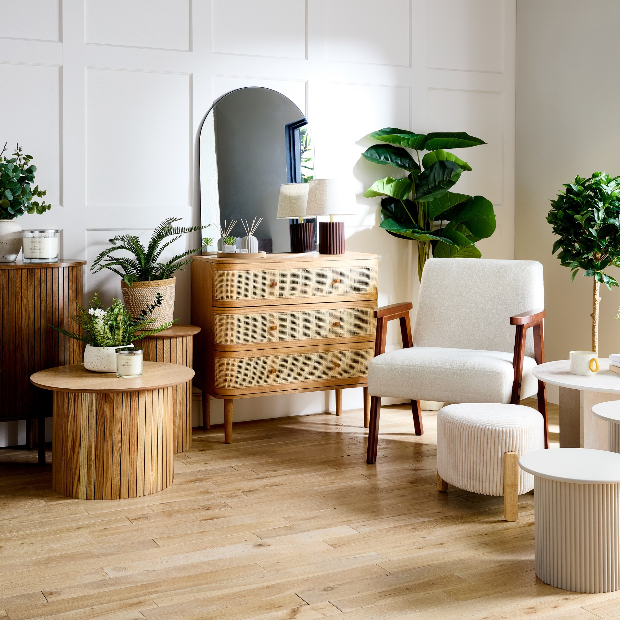 Modern, light living room with wood finishes and cream furniture.