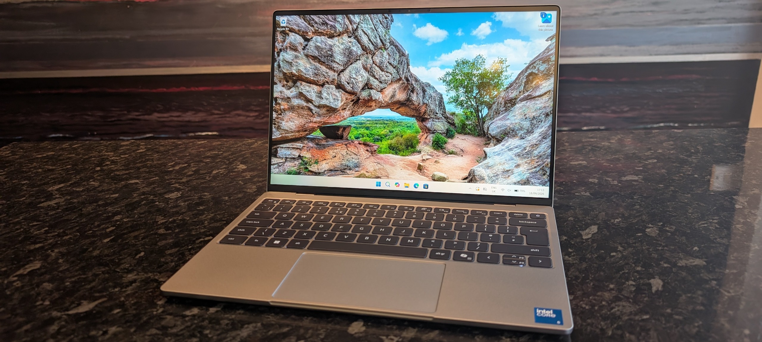 The Dell XPS 13 (2026) laptop pictured on a black marble worktop.