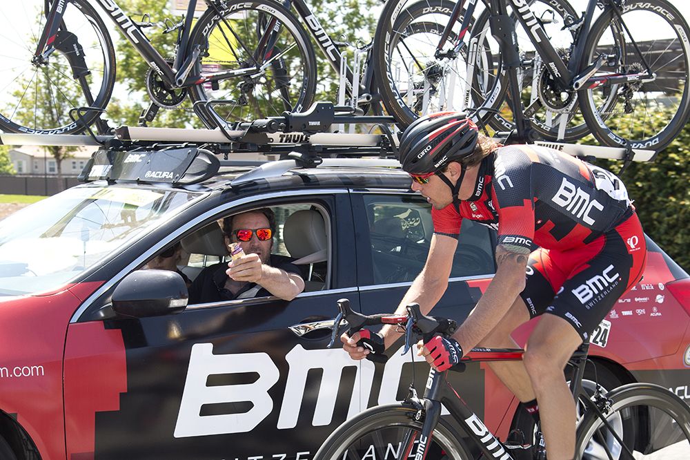 Daniel Oss (BMC) with the team car