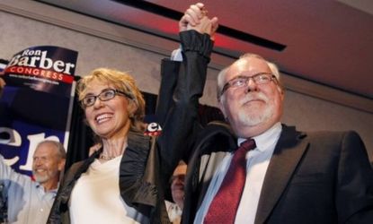 Ron Barber celebrates a victory with Gabrielle Giffords at a post election event on Tuesday night in Tucson: Though GOP-leaning outside groups outspent Democratic-leaning ones in this race $1