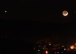 The bright moon and planet Venus shine over the city of Truckee, Calif., on Dec. 26, 2011 in this photo by skywatcher David Smoyer.