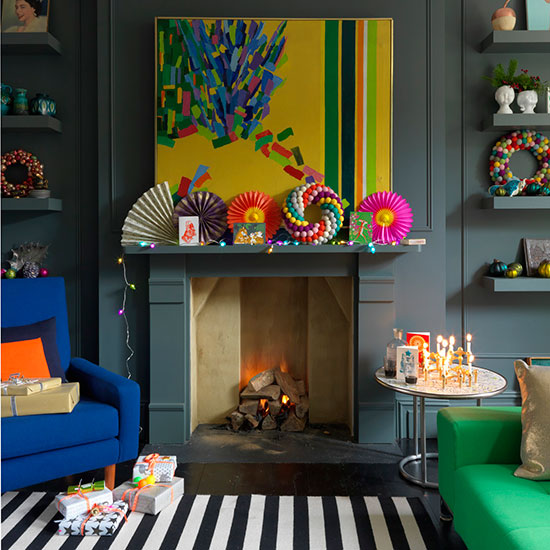 living room with fireplace and dark grey wall with decoration