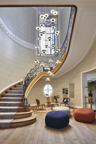 The central staircase, featuring a lighting piece typical of Scandinavian design