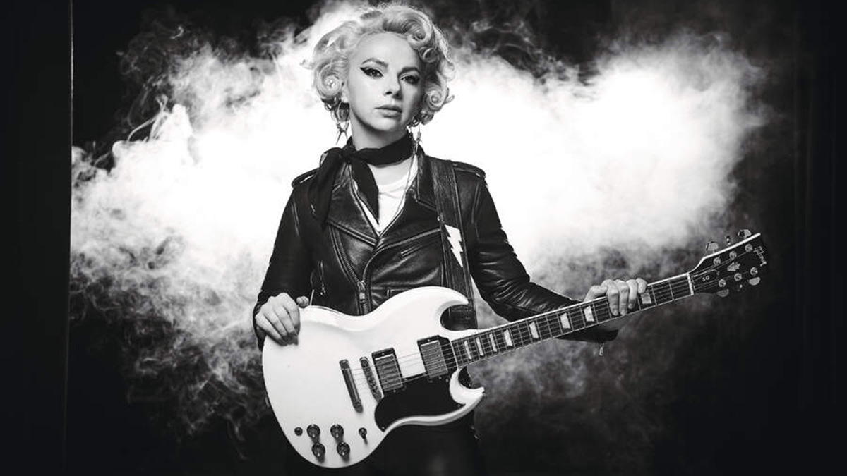 Black and white photo of Samantha Fish wielding a Gibson SG