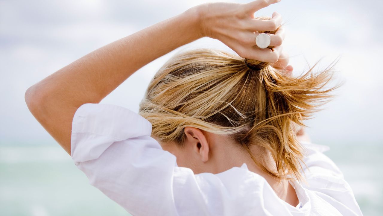 Hair, Skin, Hairstyle, Beauty, Blond, Arm, Shoulder, Hand, Bun, Long hair, 