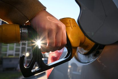 A woman pumps diesel in Mulhouse, France