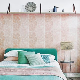 bedroom wall decor ideas, bedroom with shelf above bed and wallpaper, pink and green colour scheme