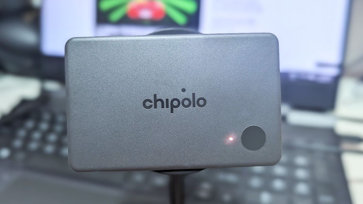 Chipolo CARD universal Bluetooth tracker for Android and iOS charging wirelessly on a magnetic Qi2 wireless charging stand.