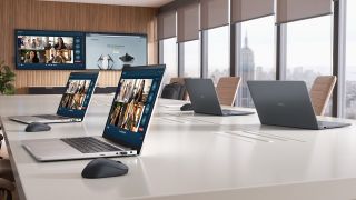 Dell 14 Plus Laptops lined up on a desk