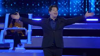 Michael McIntyre smiling with arms wide open in The Wheel US