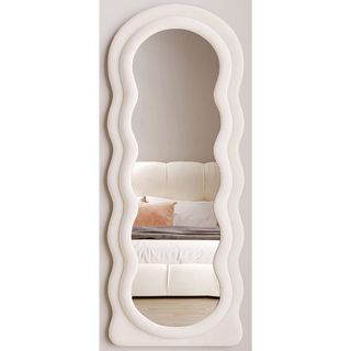 Honyee Full Length Mirror, wavy shape with white frame and bed in reflection