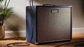 A Laney LFSUPER60-112 Combo in a living room with a guitar cable plugged into it