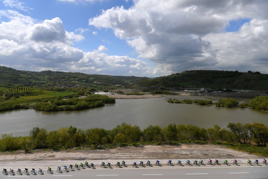 The peloton strung out