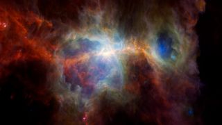 An infrared image of the Orion Nebula showing hotspots that mark the birth of new stars.