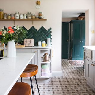 kitchen with tiled floor and green wall tiles