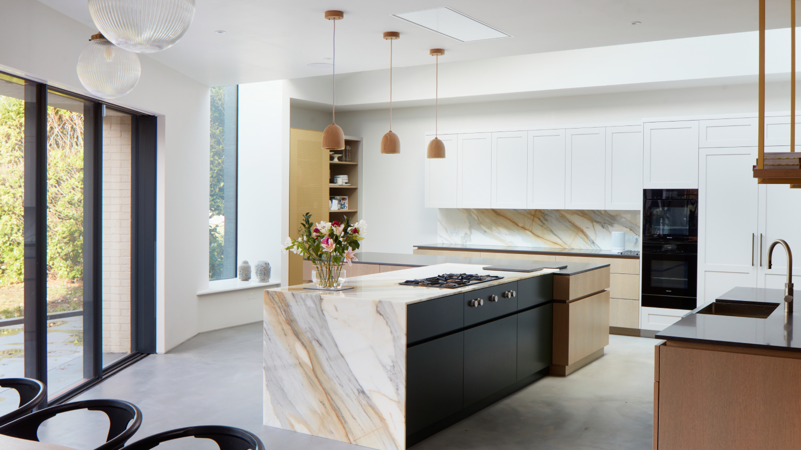 large kitchen extension with central island and bifold patio doors