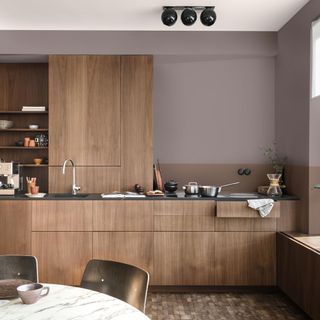 kitchen with wooden flooring and wooden cabinets