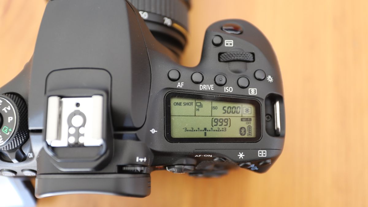 Canon EOS 90D DSLR on a table, top LCD