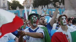 Italy fans watch their team's match against Belgium on July 2 from Piazza del Popolo in Rome..