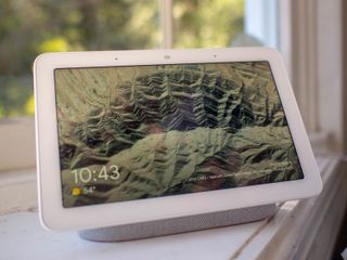 Google Nest Hub sitting on a window sill