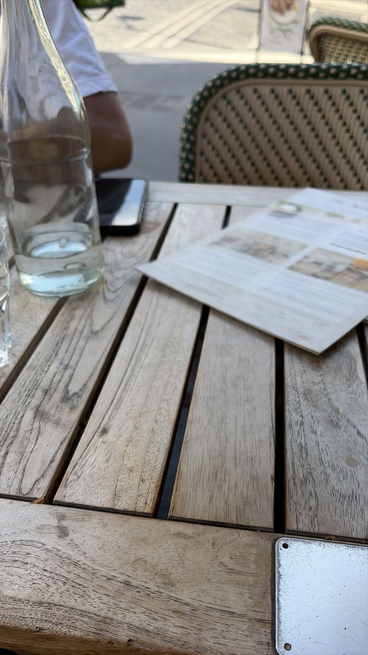 A photo of a coffee cup on a wooden table edited with Clean Up in iOS 27