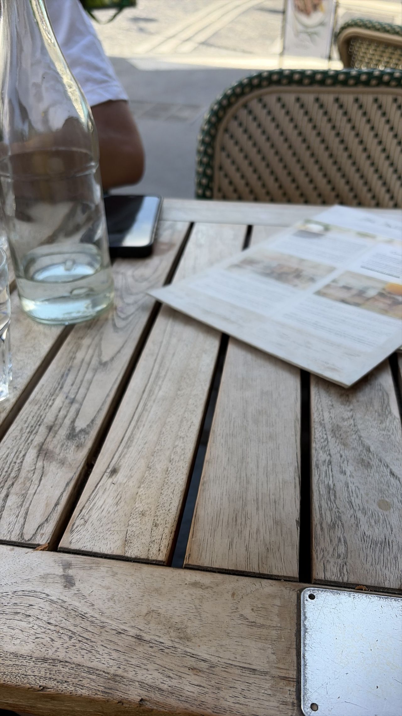 A photo of a coffee cup on a wooden table edited with Clean Up in iOS 27