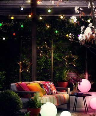deck with sofa and colour changing lights