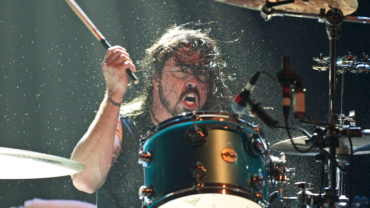 A photograph of rock drummer Dave Grohl on stage