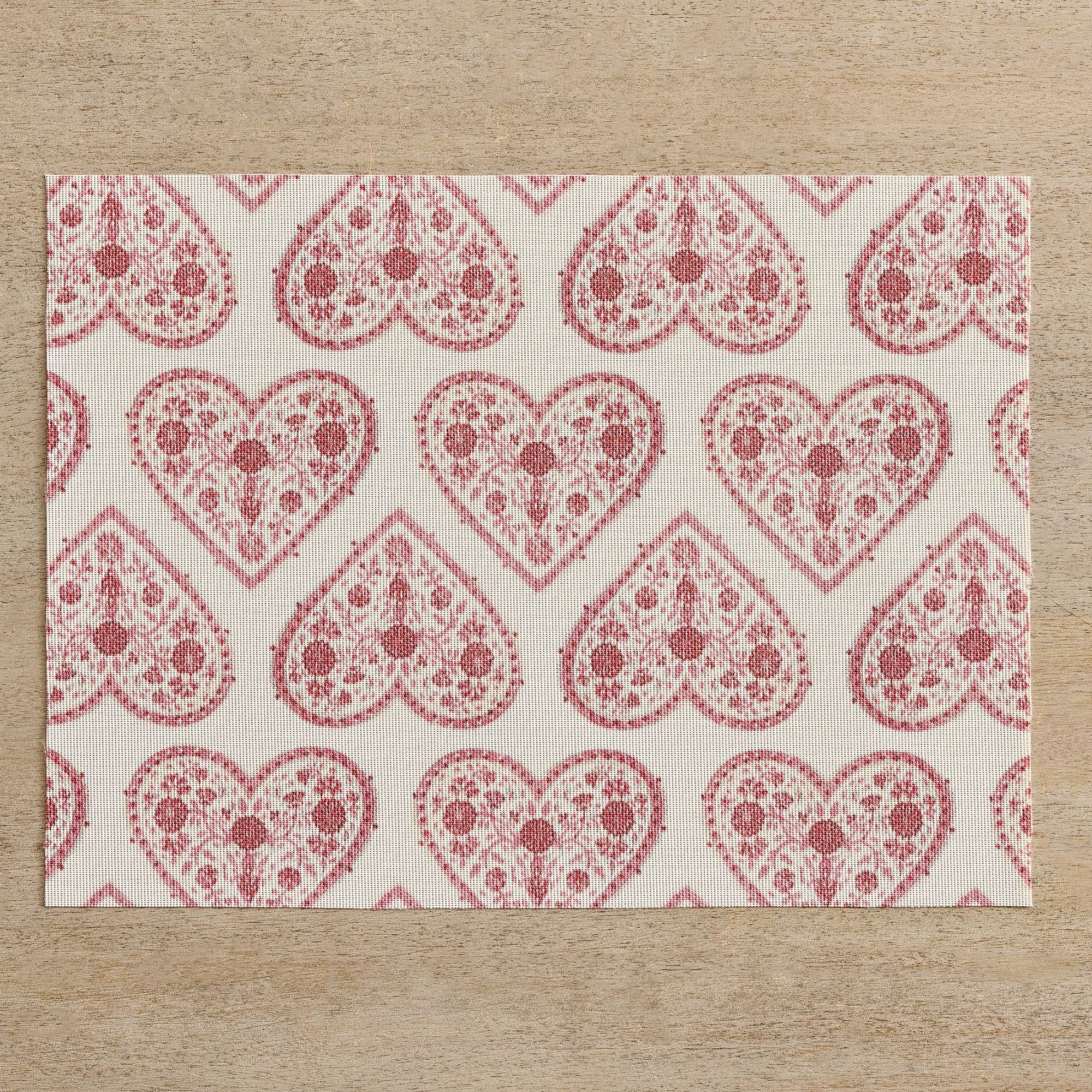 White vinyl placemat with pink heart pattern
