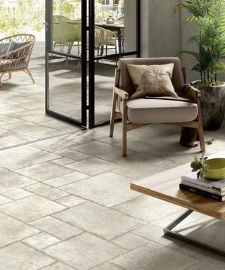 stone effect tile floor in a living room with crittall style doors - Porcelain Superstore
