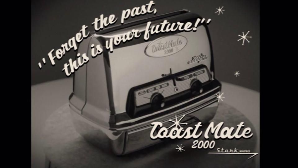 A black and white photo of a toaster, the text around reads &quot;Forget the past, this is your future!&quot; Toast Mate 2000 Stark Industry 