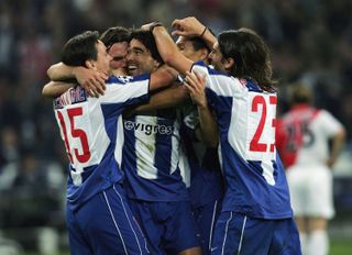 Deco (centre) is mobbed by his team-mates after scoring for Porto against Monaco in the 2004 Champions League final.