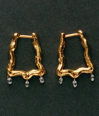 gold earrings by Patcharavipa