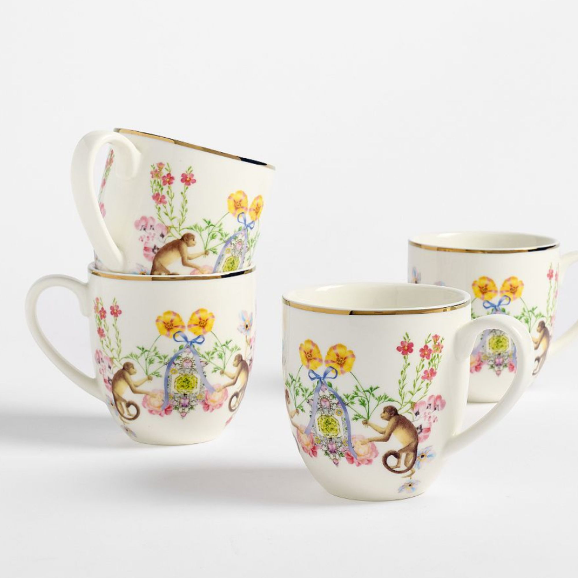 Set of four mugs with monkey and floral design