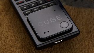 Cube Shadow Bluetooth tracker stuck to a TV remote.
