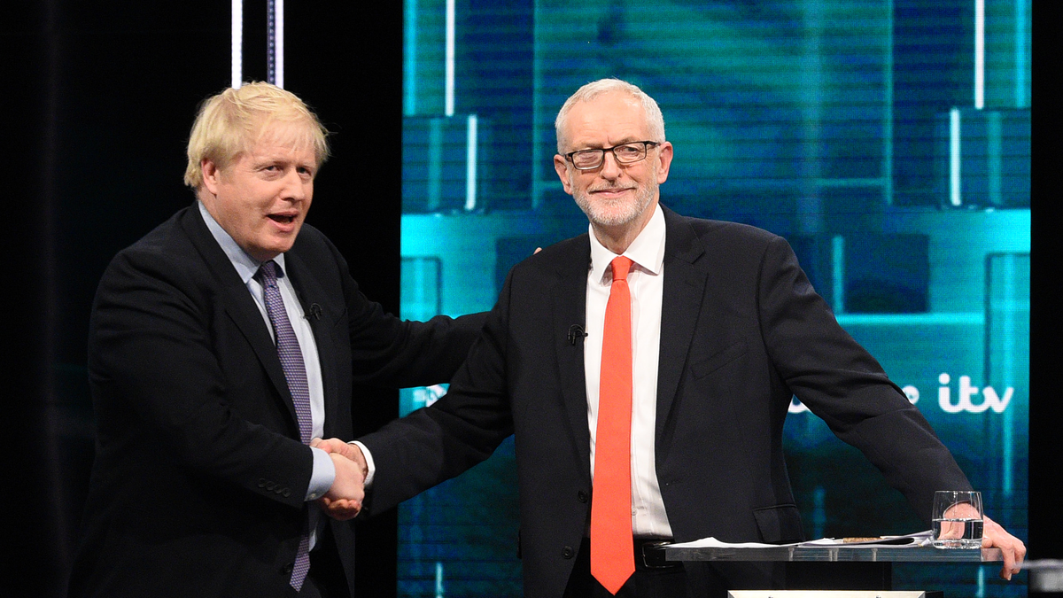 SALFORD, ENGLAND - NOVEMBER 19: (AVAILABLE FOR EDITORIAL USE UNTIL DECEMBER 19, 2019) In this handout image supplied by ITV, Prime Minister Boris Johnson and Leader of the Labour Party Jeremy Corbyn shake hands during the ITV Leaders Debate at Media Centre on November 19, 2019 in Salford, England. This evening ITV hosted the first televised head-to-head Leader’s debate of this election campaign. Leader of the Labour party, Jeremy Corbyn faced Conservative party leader, Boris Johnson after the SNP and Liberal Democrats lost a court battle to be included.