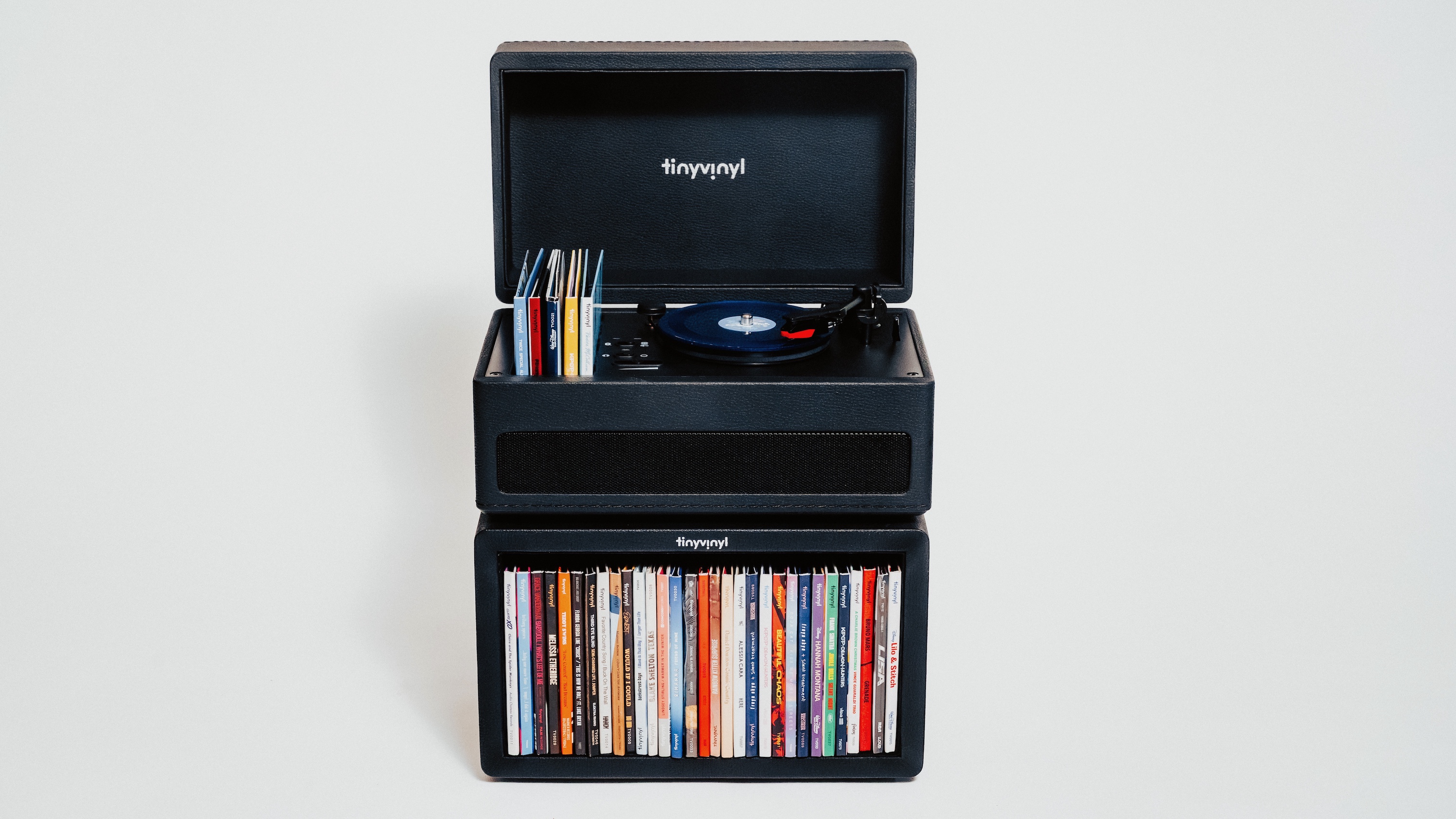 The Tiny Vinyl Player standing on top of the Crate storage unit full of Tiny Vinyl 4-inch records.