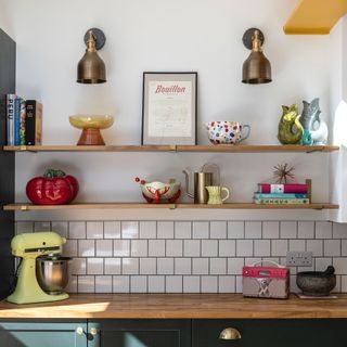 Open kitchen shelves with a display or ornaments and cookery books