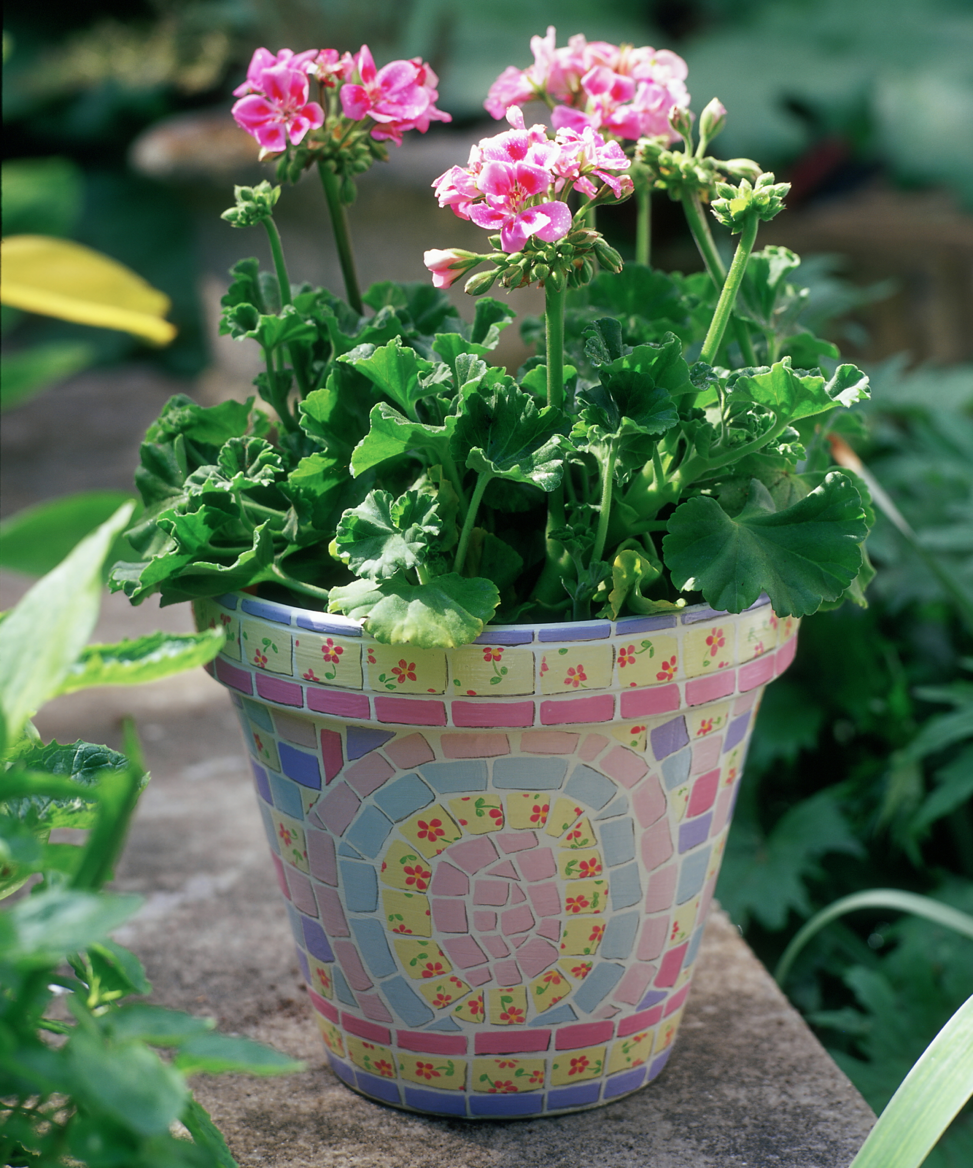 Painted plant pot with mosaic design