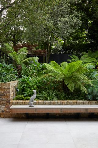 a low bench in a tropical garden