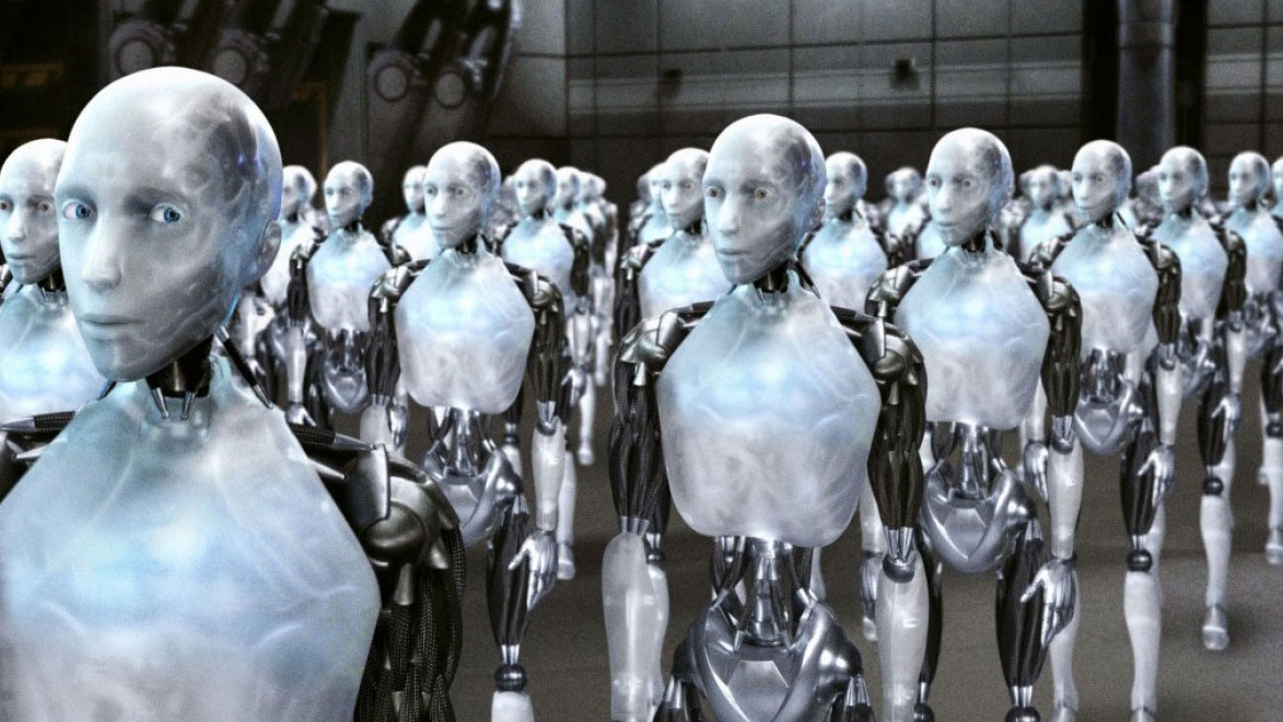 A still from the movie I, Robot in which a cohort of robots stand together