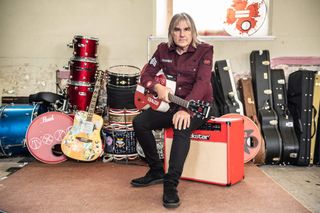 Mike Peters surrounded by musical instruments